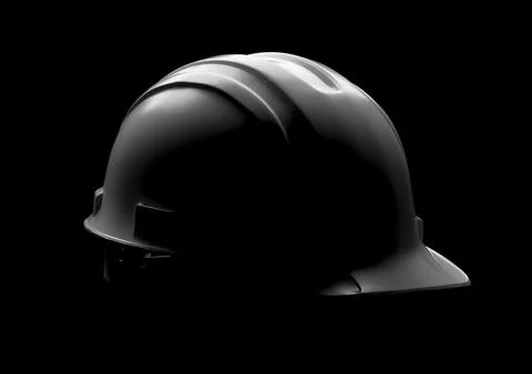 Dramatically Lit Hard Hat Isolated on a Black Background. Stock Illustration