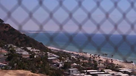 Dramtic ocean through fence Stock Footage 67638395