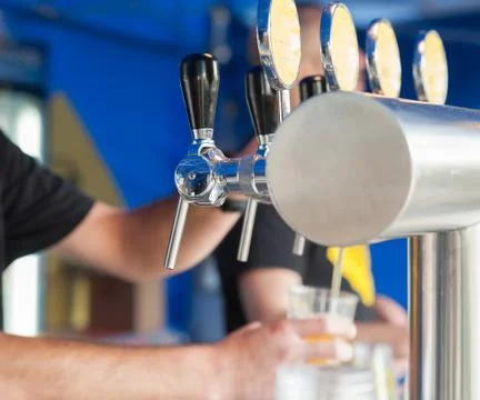 Draught draft beer taps in a bar . Foto stock