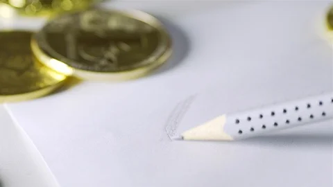 To draw bitcoin on paper. Gloss of coins. 2 coins Stock Footage 88482142