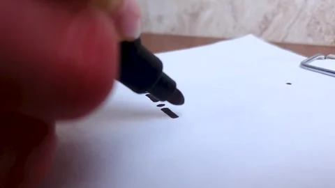 Draw with a black marker on a white sheet of paper. Using a marker,line. Stock Footage 302377249
