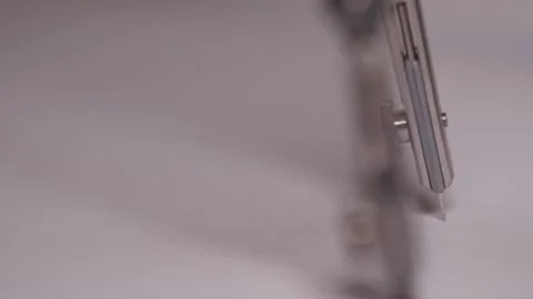 Draw circle with compass slow motion Stock Footage 104885686