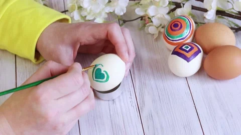 Draw a heart on an egg Stock Footage 233489539