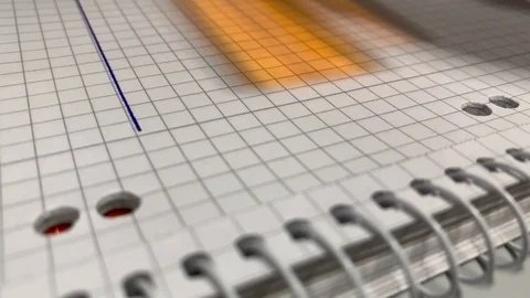 Draw lines with a ruler on a piece of paper in a notepad Stock Footage 123856827