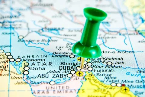 Draw-pin stick into real map, travelling to Dubai Stock Photos