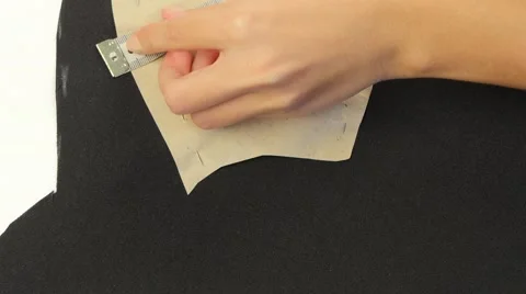 Draw white chalk on black fabric. Close up Stock Footage 69252547