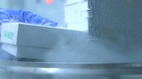 Drawer being inserted into liquid nitrogen cryogenic cold storage - medical, Stock Footage