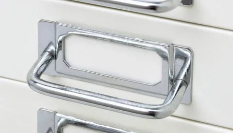 A drawer cabinet with an empty label 스톡 사진