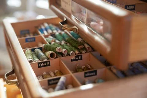 Drawer with different colored threads in it is the windfall for every housewife Stock Photos