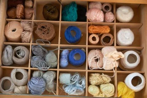 Drawer with different colored threads in it is the windfall for every housewife Stock Photos