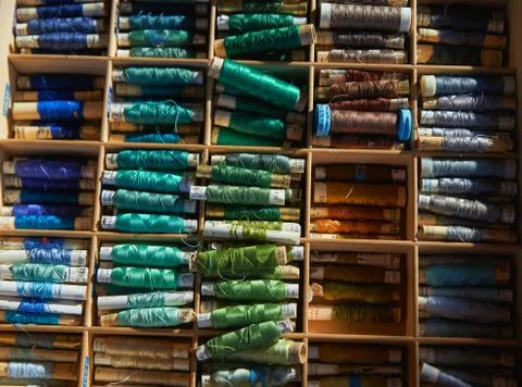 Drawer with different colored threads in it is the windfall for every housewife Stock Photos