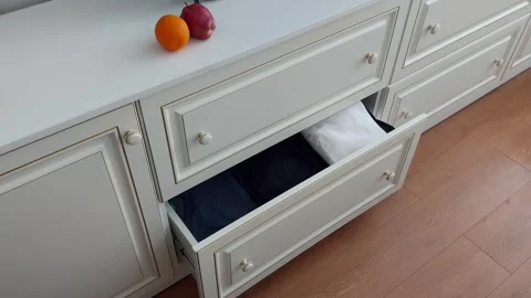 Drawer Dynamics: Effortless Sweater Retrieval 스톡 동영상 306063005