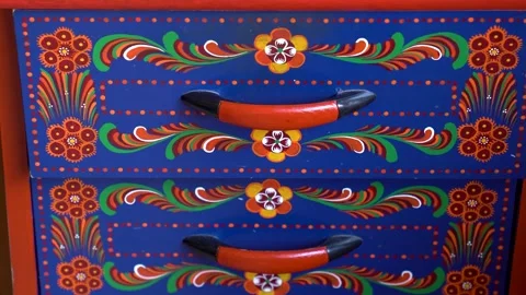 Drawer fronts featuring traditional Matyó floral designs with red handles Vidéo 314448101