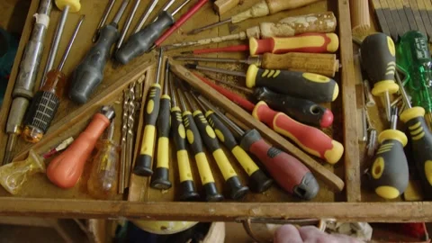 Drawer with tools and screwdrivers in carpenters workshop Stock Footage 182909283