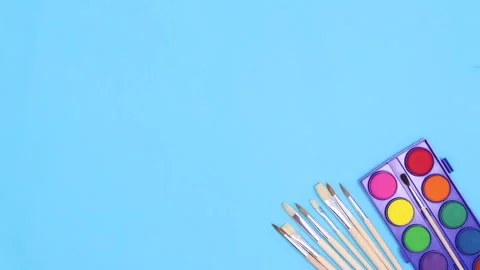 Drawing and art tools brushes and colors appear on blue theme. Stop motion Vídeo Stock 156975556
