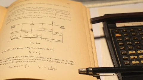 Drawing and calculation tools vintage. In particular, an electronic calculato Stock Footage 103316190