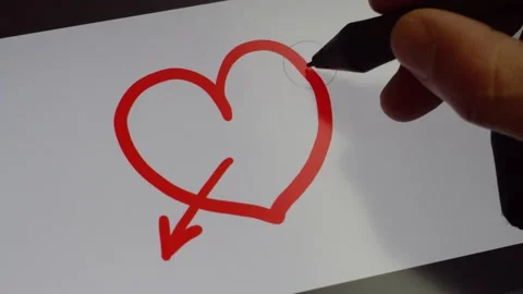 Drawing an arrow on a heart 4K Stock Footage 170065729