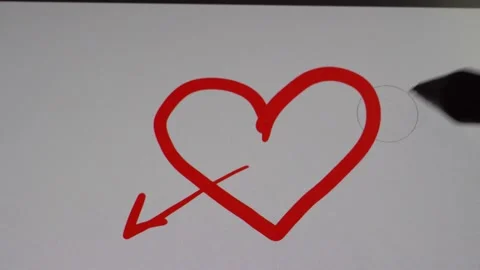 Drawing of an arrow on a red heart 4K Stock Footage 170065607