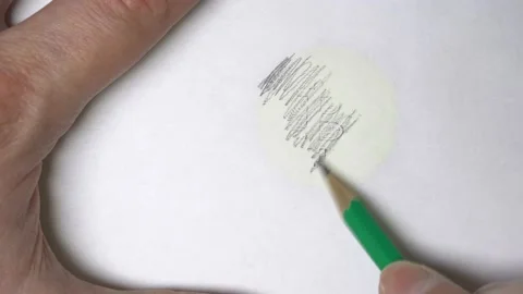 A drawing of a bitcoin of a stroke with a white sheet using a pencil. Stock Footage 165507142
