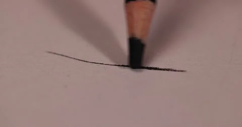 Drawing with a black pencil on paper , drawing on paper with a wooden pencil Stock Footage 326366041