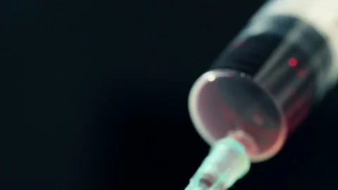 Drawing blood into syringe Stock Footage 74283899