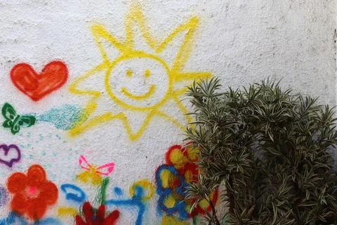 Drawing children on the wall Stock Photos
