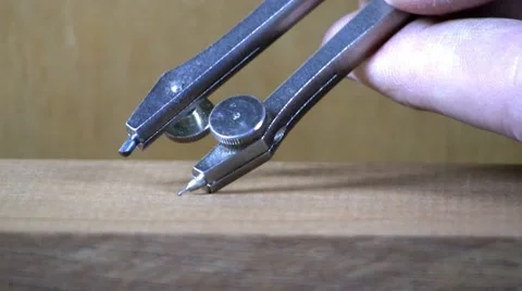 Drawing circle on wood with compass Stock Footage 10602914