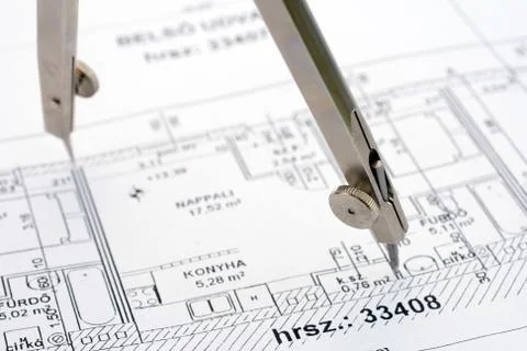 Drawing compass on a floor plan Stock Photos