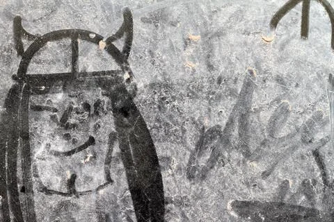 Drawing on a dirty window Foto stock