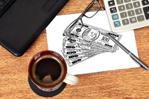 Drawing dollars on paper Stock Photos