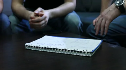 Drawing Draft. Hands of  people who draw a draft with pen on notebook Stock Footage 48400913