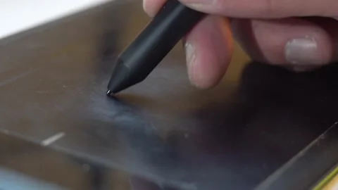 Drawing with an electronic pen on a graphics tablet 4K Stock Footage 170065646