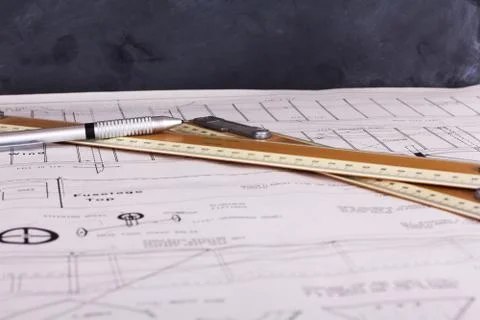Drawing equipment on plans for making a model aircraft Stock Photos