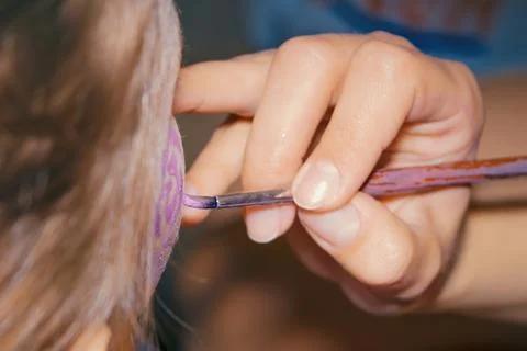 Drawing on the face of child Stock Photos