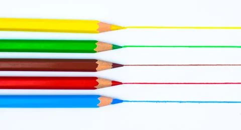 Drawing with five different colored pencil crayon on a white background Stock Photos