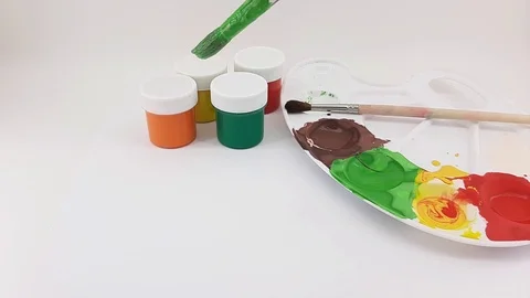 Drawing with gouache on a white sheet Stock Footage 124828654
