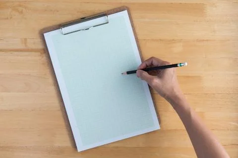 Drawing on graph paper with a pencil Stock Photos
