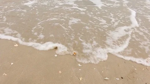 Drawing hart on beach 스톡 동영상 73714306