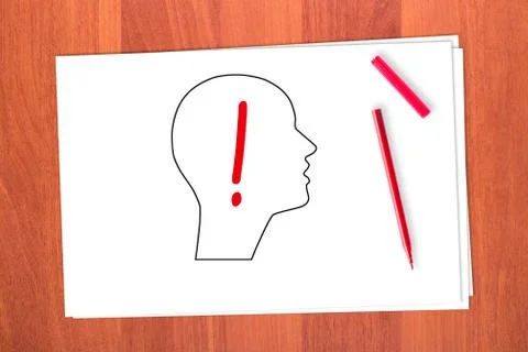 Drawing head and exclamation mark Stock Photos