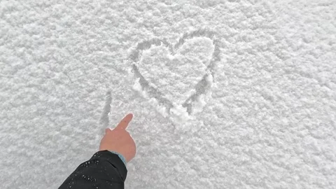 Drawing heart and love text on fresh winter snow Stock Footage 321752332