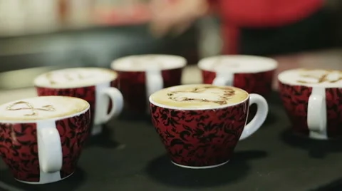 Drawing a heart on a cappuccino Stock Footage 64983257