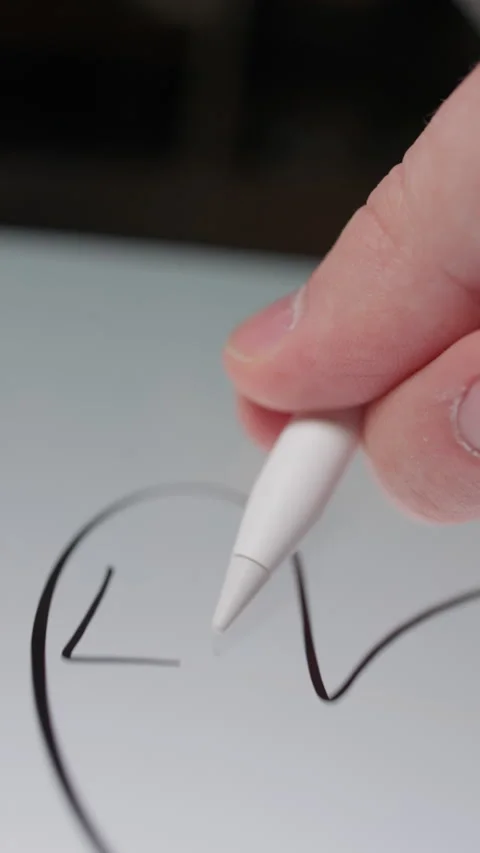 Drawing A Heart With Love Text On Tablet Using Stylus Stock Footage 308579807