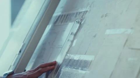 Drawing of the house. The architect draws using the easel Stock Footage 68117301