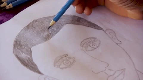 Drawing of a human figure with pencil.	 Stock Footage 202154867