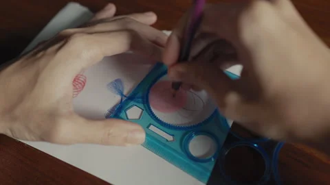 Drawing Hypotrochoid Shape with Spirograph Tool for Geometric Art Stock Footage 330927296