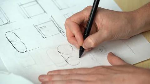 Drawing industrial design plans for consumer product. Stock Footage