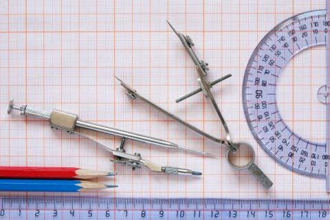 Drawing Instrument On Graph Paper Stock Photos