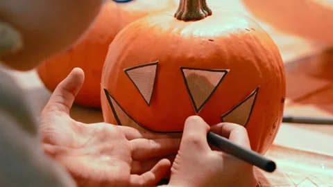 Drawing Jack O Lantern Face Template on Pumpkin Stock Footage 342281382