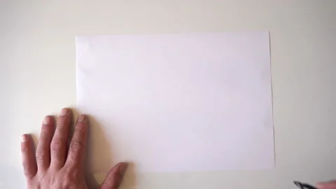 Drawing a light bulb with a marker on paper 4K Video stock 89634404