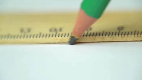 Drawing a line with pencil using ruler Stock Footage 87185828